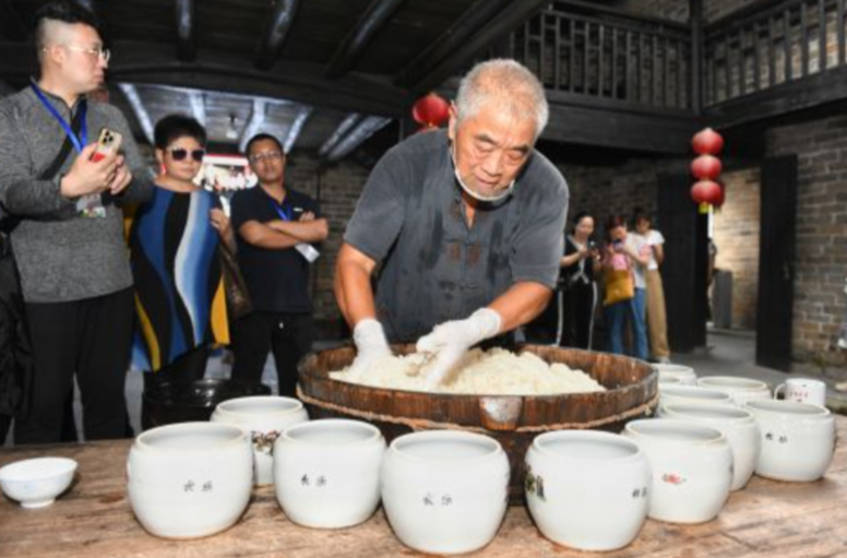 【中国新闻网】湖南汨罗长乐甜酒飘香海内外 海外华媒聚焦“甜蜜产业”